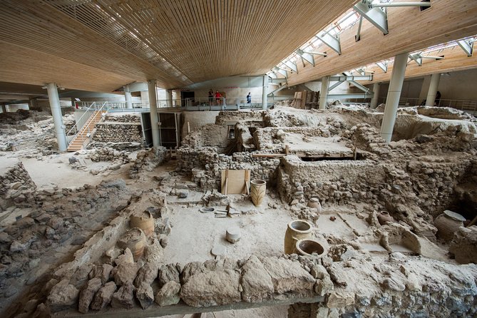 Archaeological Bus Tour To Akrotiri Excavations & Red Beach - Perissa or Perivolos black-sand time: swimming, fish, and a reset