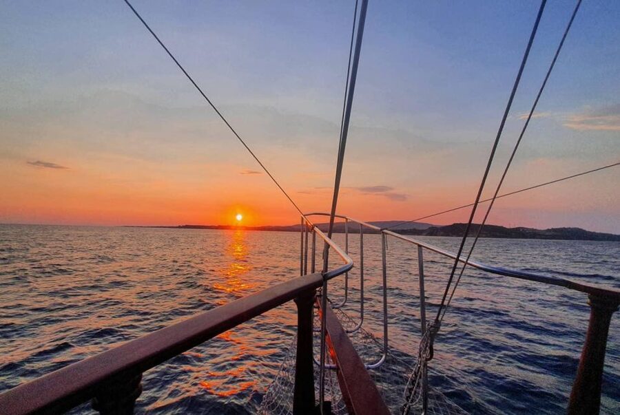 Argostoli: Sunset Cruise with Swim Stops, Dinner, and Wine - Xi Beach red-brick sands, weather swaps, and what the second stop is like