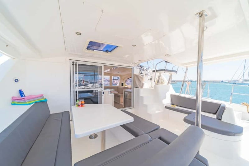 Athens: Half-Day Sunset Catamaran Cruise with Meal & Drinks - Swim and snorkel breaks in the evening waters of the Saronic Gulf