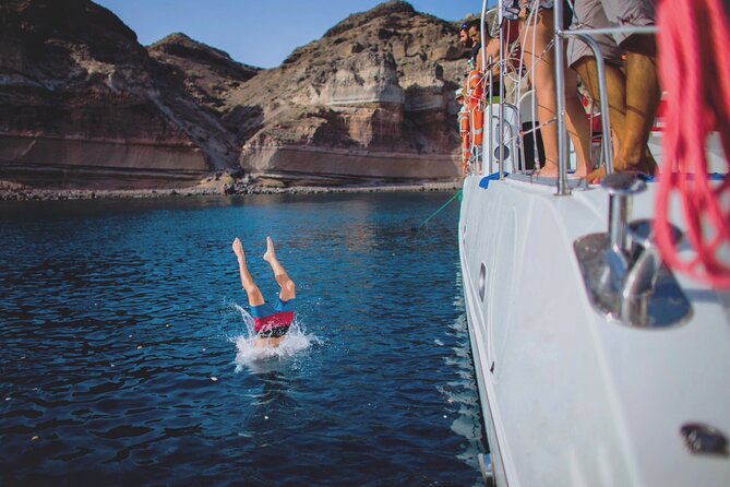 Beautiful Day Catamaran Caldera Cruise incl. Meal & Drinks - Volcanic Red Beach and Vlychada Port: short swim time, big payoff