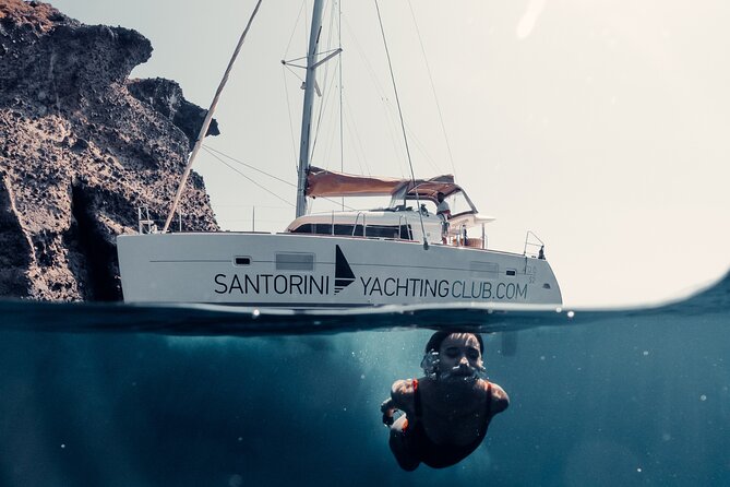 Beautiful Day Catamaran Caldera Cruise incl. Meal & Drinks - White Beach and Mesa Pigadia, then the BBQ starts moving