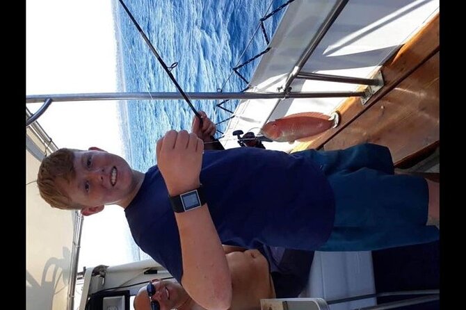 Captain Manolis Fishing with barbecue on the boat - BBQ on the boat: Greek salad, bread, and fresh fish