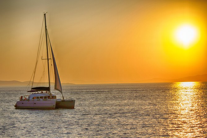 Catamaran Day & Sunset Cruises with meals Drinks and transportation - Lunch on Board: Greek Seafood Pasta, Meat Options, and Rose Wine