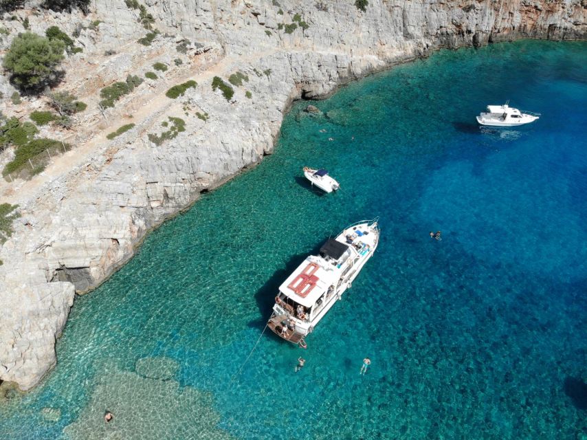 Chania: Menies Beach & Chironisia Bay Cruise with Snorkeling - Menies Beach: snorkeling WWII relics under ancient Diktynna