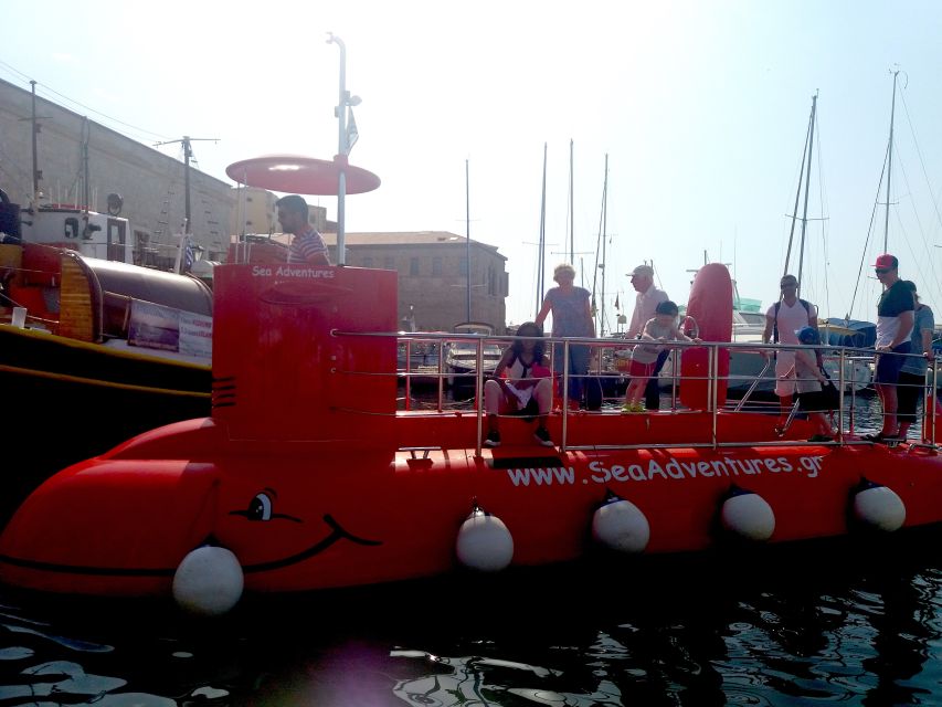 Chania: Semi-Submarine Boat Underwater Experience - Deck views: Venetian structures, the lighthouse, and White Mountains light
