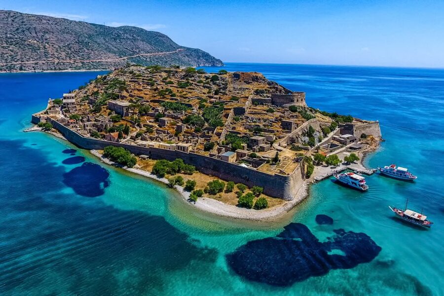 Crete: Spinalonga, Elounda, & Agios Nikolaos Boat Tour & BBQ - Elounda as your launch pad on the coast