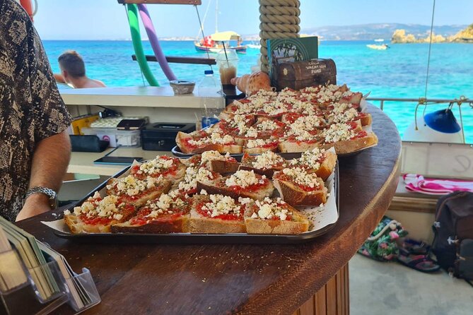 Dreamy Sails Daily Cruises at Argostoli Kefalonia Island - On-deck activities: snorkel gear, paddle boards, and flotation aids