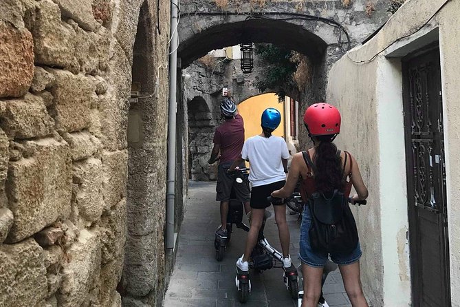 Explore the Medieval city of Rhodes on scooters - 2 hours - Mandraki Harbour, Windmills, Lighthouse, and Knights Castle Views