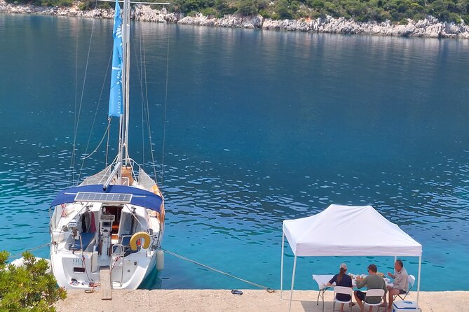 From Agia Efimia: All Inclusive Sailing Day Tour to Ithaca - Onboard: Menios and Tasos, plus snacks, drinks, and quick photo sharing