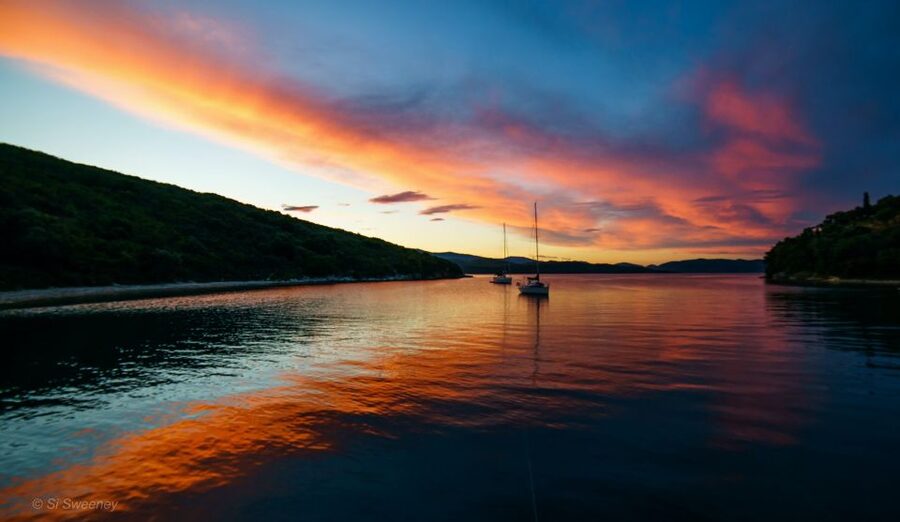 From Heraklion: Sunset Cruise to Dia Island - Dia Island time: Saint George Bay, cedar trees, and real water breaks