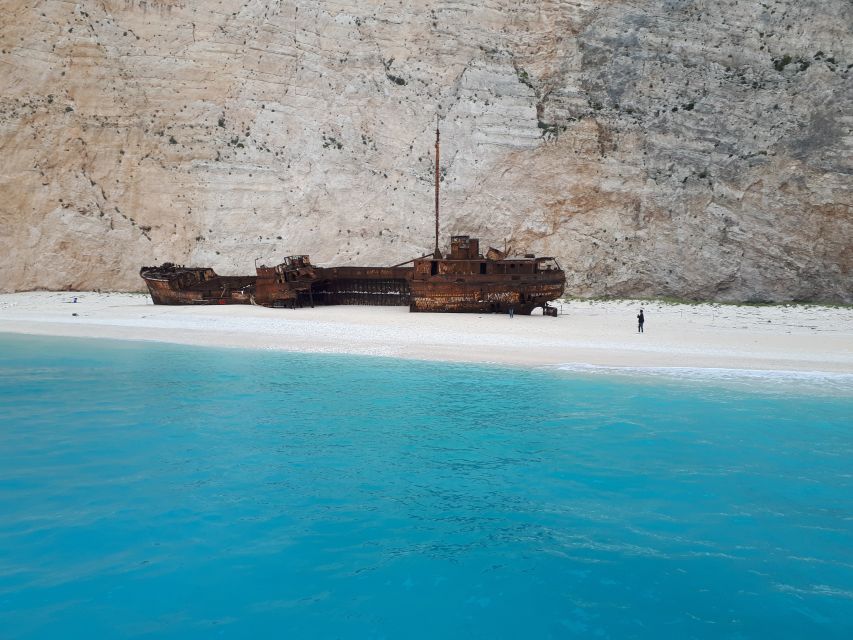 From St.Nikolaos: Boat Cruise to Navagio Beach & Blue Caves - English narration, crew style, and the captain factor