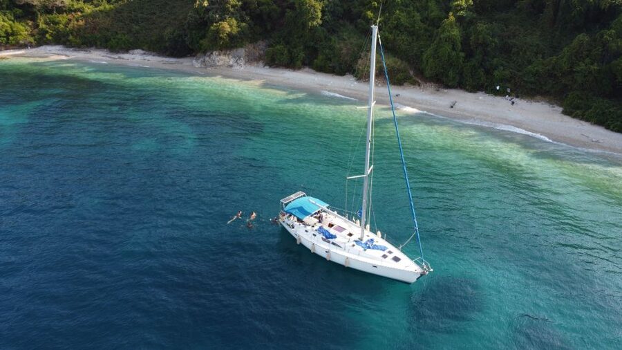 Gouvia: Corfu Island Sailing Trip with Snack and Soft Drinks - Gialiskari with plates: the swim break where the fun ramps up