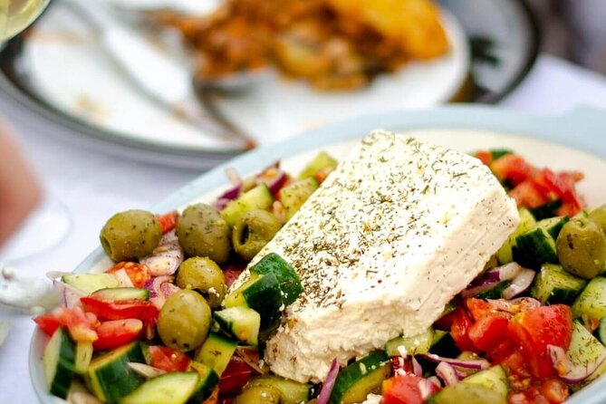 Greek Cuisine Cooking Class in Santorini with Recipes and Wine - The menu in real life: tzatziki, Greek salad, tomato fritters, and pasticio