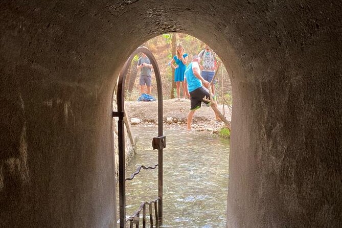 Guided hike to the seven springs from Archangelos - The Tunnel Moment: Narrow Passage, Fresh Water, Wet Feet