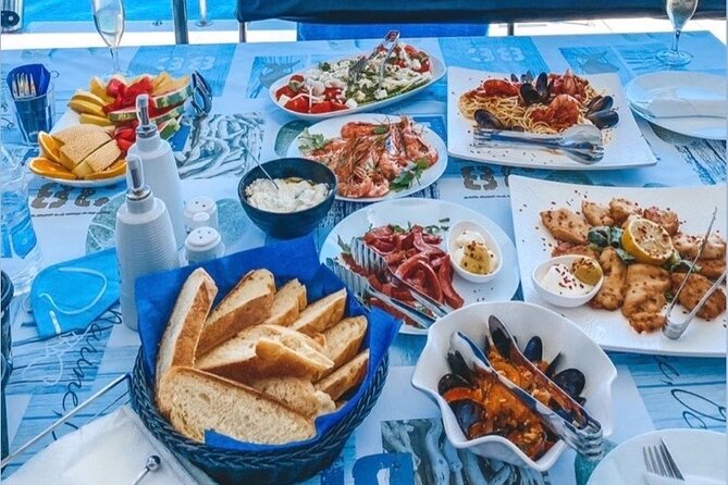 Half-Day Exclusive Catamaran Cruise in Santorini with Meal and Open Bar - Santorini Volcano and Hot Springs Swim: Short, Warm, and Real