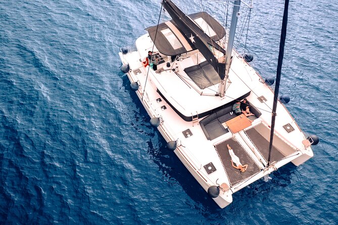Half Day Premium Catamaran Cruise in Santorini including Oia - Oia timing, Ammoudi Bay, and that Venetian lighthouse sail-by
