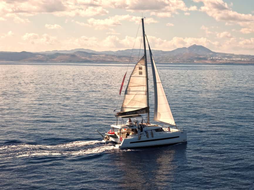 Hersonissos: Sunset Catamaran Cruise with Snacks and Drinks - Your 3.5-hour Timeline: aperitif, sailing, and the Agios Georgios Bay water stop