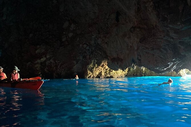 Kayak Trip to Hidden blue Cave, with lunch & fruits. - What to Bring: Swim Gear, Sun Protection, and Water Shoes