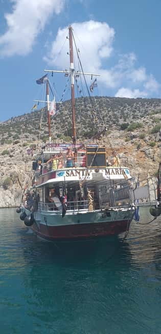 Kos: 3-Island Cruise with Greek BBQ Lunch and Swimming - Getting a good seat and finding shade on a full boat