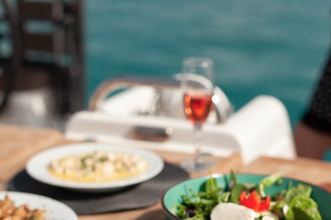 Luxury Catamaran Morning Semi-Private & Greek Gastronomy Athens - Hydrousa life: swimming, sunbathing, and a little island magic