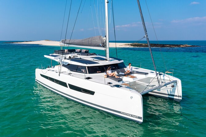 Mykonos: Brand-New Catamaran Cruise with Meal, Drinks & Transport - Delos pass-by: UNESCO views with less fuss