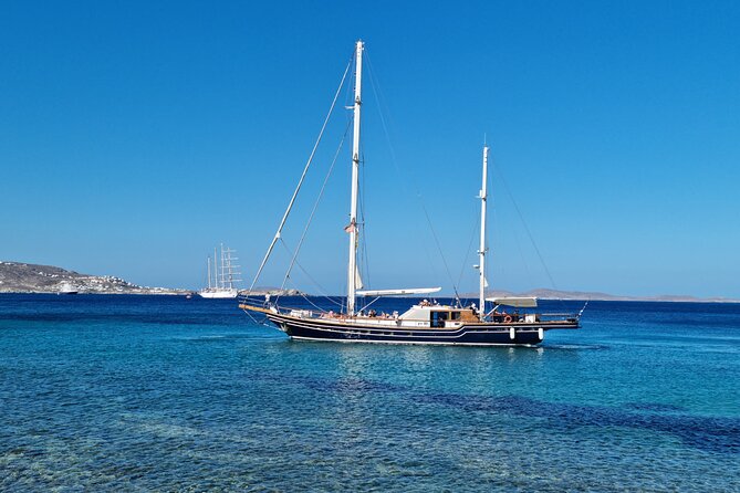 Mykonos Sail Cruise to Rhenia, Guided Tour of Delos, Lunch&Drinks - On to Delos: UNESCO Ruins, Apollo Myth, and a Licensed Archaeologist Guide