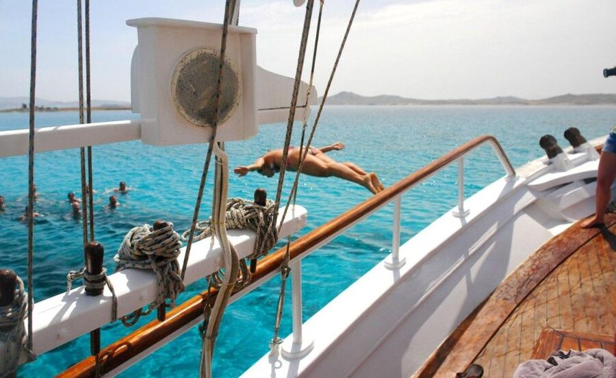 Mykonos: Sunset Party Boat Cruise with 1 Drink - North coast cruise on a traditional wooden boat