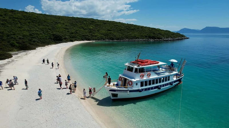 Nydri: Island Hopping Boat Cruise with Beach BBQ Lunch - Gerakas Beach on the mainland: BBQ lunch with umbrellas and real swim time