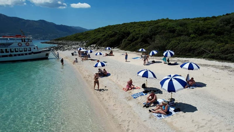 Nydri: Island Hopping Boat Cruise with Beach BBQ Lunch - Skorpios and the Onassis story: a last swim with glamor-flavored context