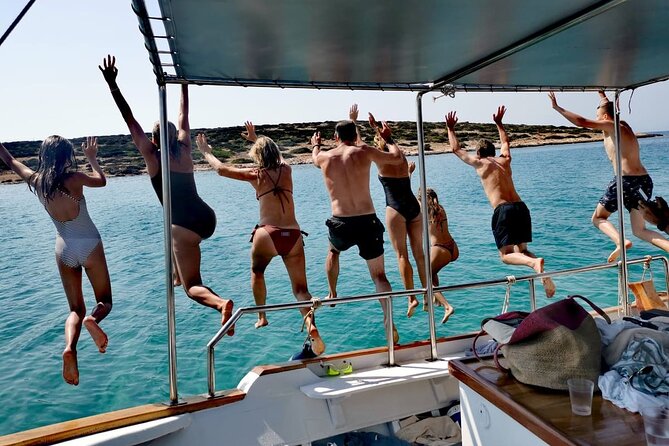 Paros Half Day Boat Tour from Naoussa port and Bay . - What you get on board: snorkeling gear, fruit and cheese, and local wine