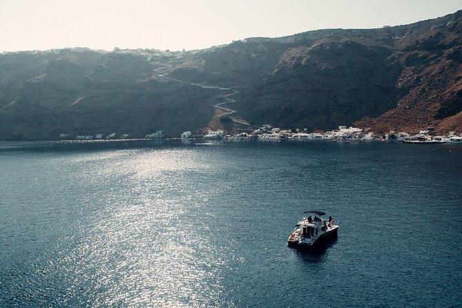 Private Caldera Cruise with Power Catamaran ENJOY incl. Meal & Drinks - Water toys and deck time: snorkeling, SUP, and Wi-Fi for sanity