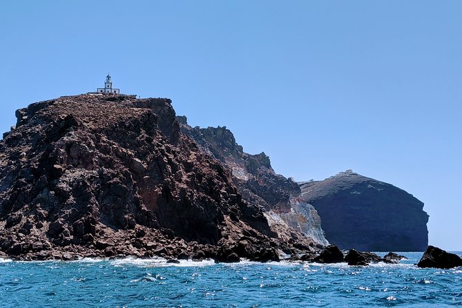 Private Full-Day Motor Yacht Cruise with Meal, Open Bar+Transfers - Sighting the Lighthouses and Caves: Passing the Details That Make Santorini Feel Real