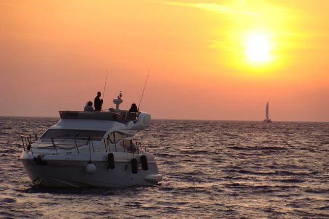 Private Motor Yacht Cruise with BBQ, Open Bar & Transfers - Red Beach and White Beach: the boat-only swimming stops