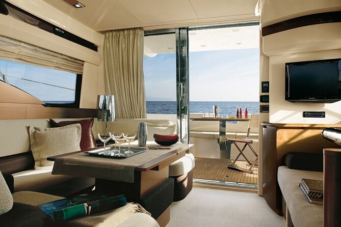 Private Motor Yacht Cruise with BBQ, Open Bar & Transfers - Caves, Venetian Lighthouse, and the Caldera Coast views
