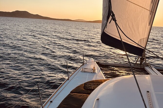 Private Mykonos Catamaran Day Cruise with Meals & Water Toys - Stop 1: Ornos, where the day starts scenic and calm