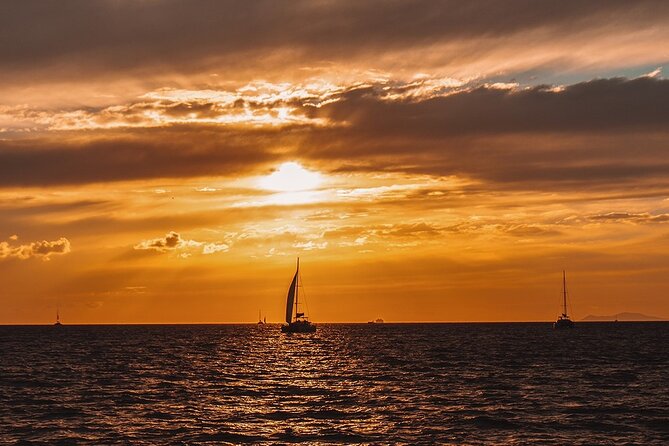 Private Sunset Cruise with Full Greek Dinner - Sailing from Akrotiri Red Beach to White Beach and the Venetian lighthouse