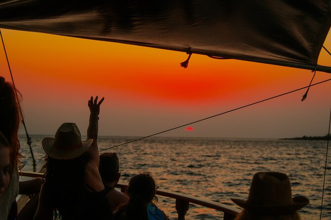Queen Bee Sunset Cruise with Swim Stops and Dinner - On board: wooden decks, music, and the best spots to watch the sunset