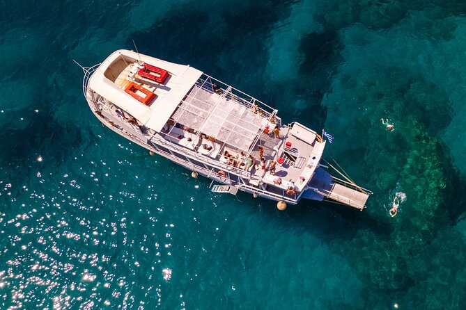 Rhodes Bay to Bay Swim Cruise-Greek Buffet w/wine included - Setting off from Mandraki Old Port, plus a quick Colossus moment