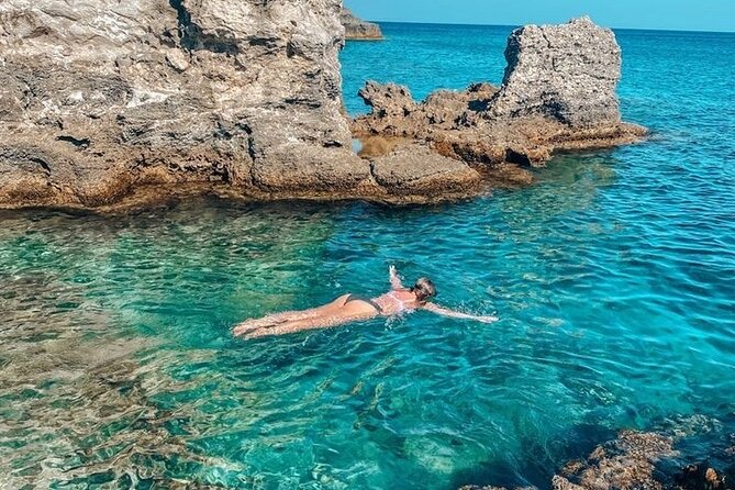 Rhodes Bay to Bay Swim Cruise-Greek Buffet w/wine included - Anthony Quinn Bay: deep water snorkeling and a tiny feeding ritual