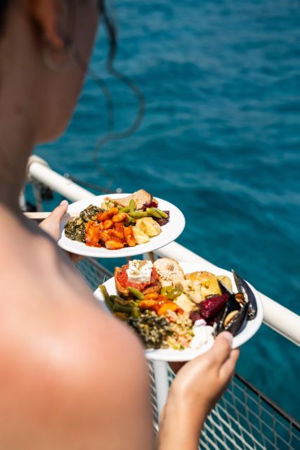 Rhodes: Bay to Bay Swim Cruise with Greek Buffet and Wine - Finding the Meeting Point: Mandraki Port Near Nea Agora