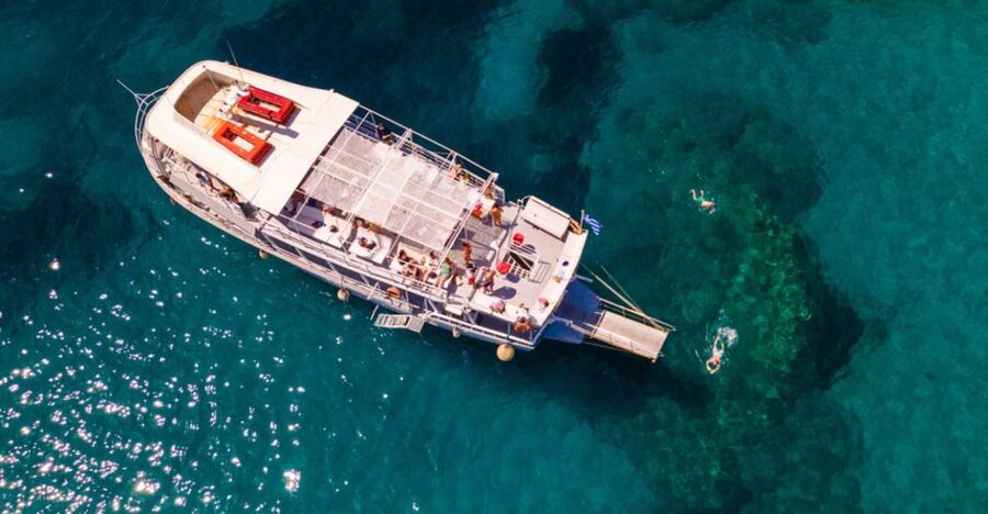 Rhodes: Bay to Bay Swim Cruise with Greek Buffet and Wine - Afandou Beach and the Caves of Traganou