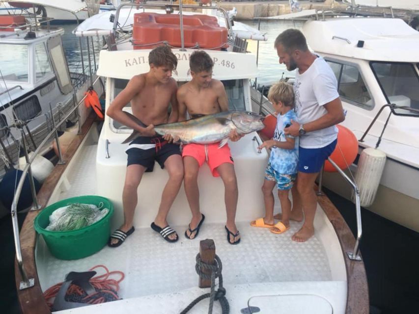 Rhodes: Captain Manolis Fishing Trip with BBQ and Swimming - Views, Drinks, and the Panoramic Cruise Back Toward Rhodes