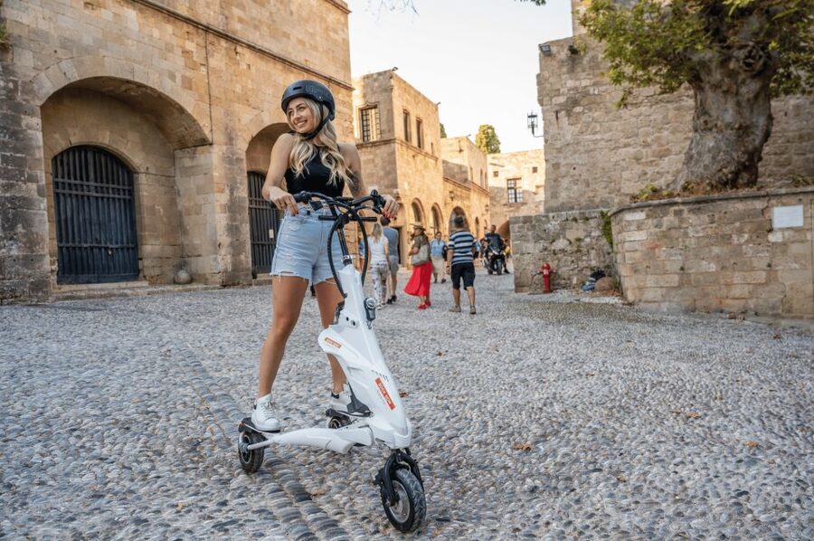 Rhodes: City Highlights and Medieval Town Trikke Tour - Mandraki Harbor: deer, lighthouse, and the legend of the Colossus
