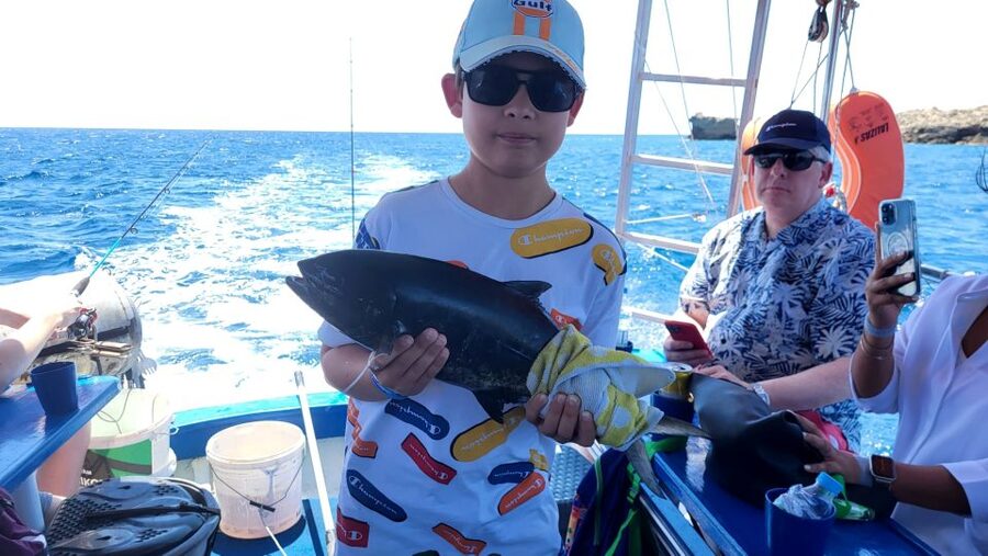 Rhodes: Fishing Trip, Snorkelling, BBQ, & Professional Guide - Anchoring for swimming and snorkelling in a quiet bay