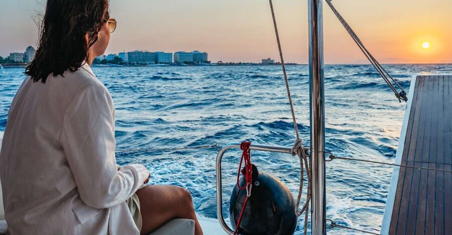 Rhodes: Sunset Catamaran Cruise with Dinner Buffet & Drinks - The sunset segment near Rhodes Town: watching from open water