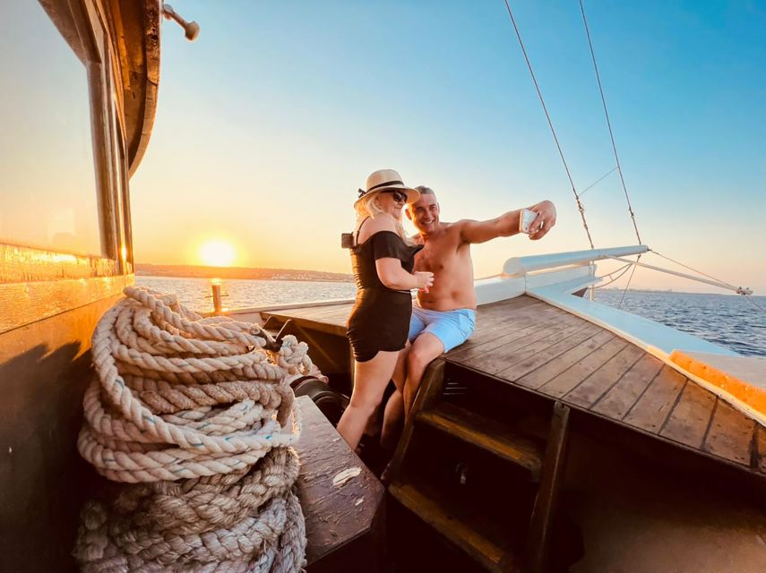 Rhodes: Sunset Cruise with Greek BBQ and Unlimited Drinks - Mandraki Harbour, Beanbags, and the Aphrodite Duchess Welcome