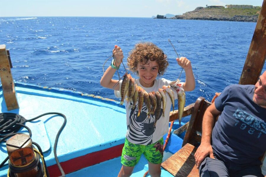 Rhodes Town: Fishing Boat Trip with Fish Meal and Swim Stops - Rhodes Town departure at Mandraki Harbour