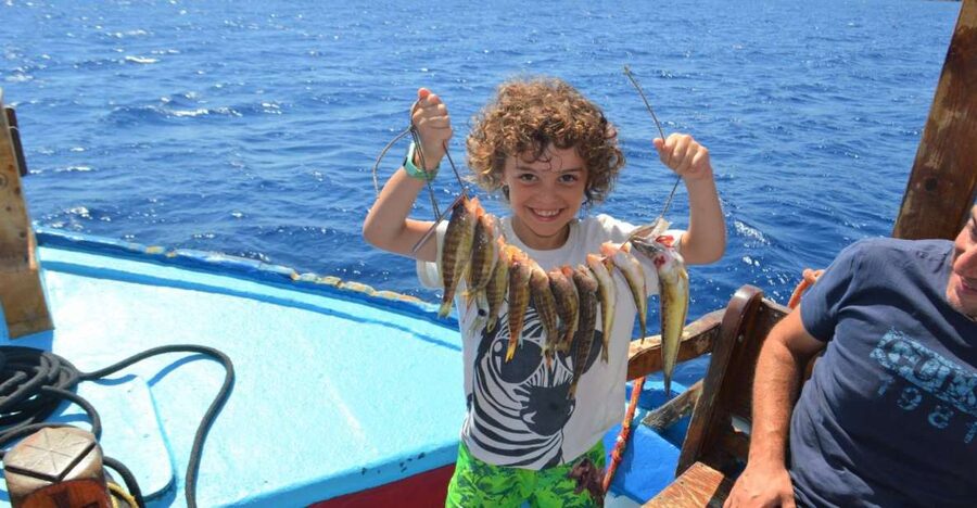 Rhodes Town: Fishing Boat Trip with Fish Meal and Swim Stops - A traditional 10.5 meter boat, up to 12 people