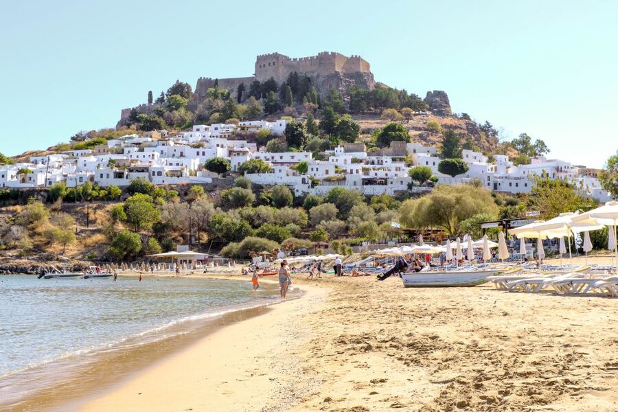 Rhodes Town: Scenic Cruise to Lindos with Swim Stops - The sail north-to-south vibe: deer statues, lighthouses, and east-coast passes