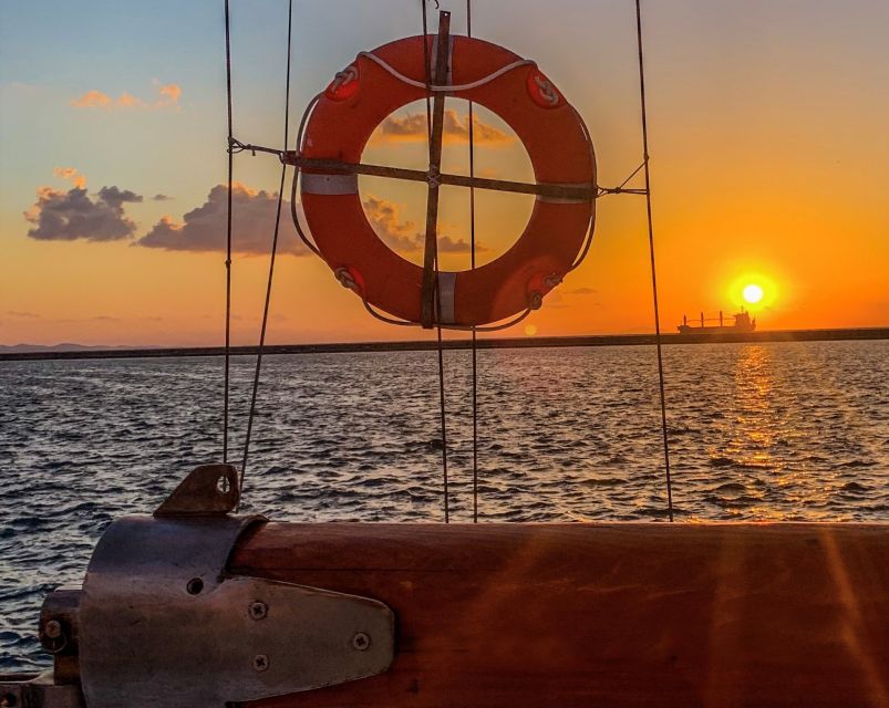 Rhodes Town: Sunset Boat Cruise with Drinks & Snacks - Kallithea Springs caves and the guided part that adds meaning